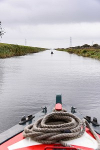 A view rarely seen over the last ten year!. Looking over the prow of a narrowboat navigating the Old Bedford river towards Welney and Welches Dam lock.