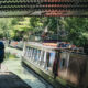 narrowboat under bridge summer
