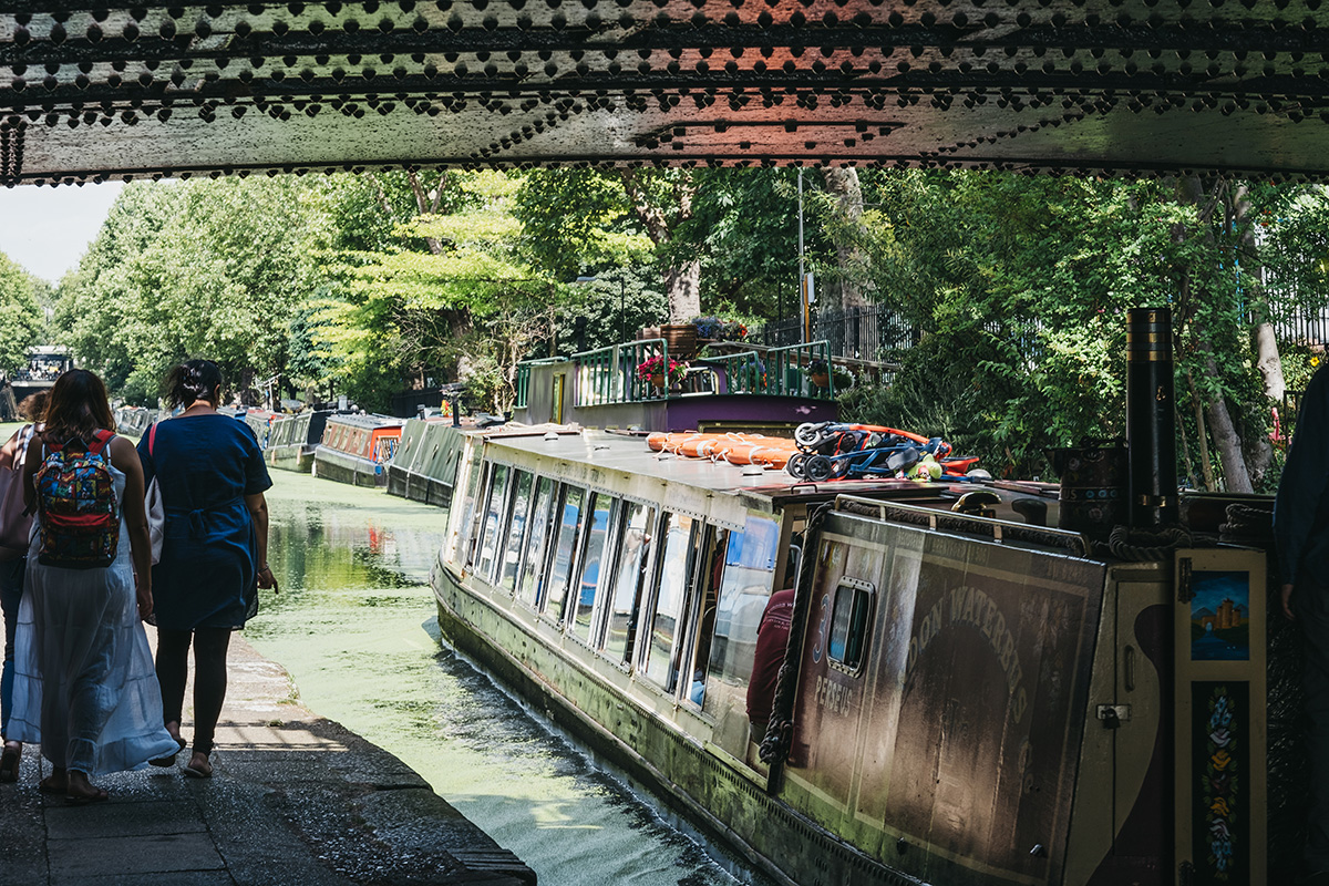 narrowboat under bridge summer