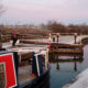 winter narrowboat passed lock alice elgie