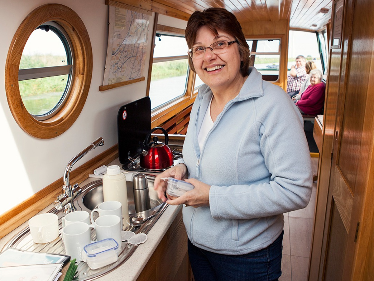 group on board boat making tea